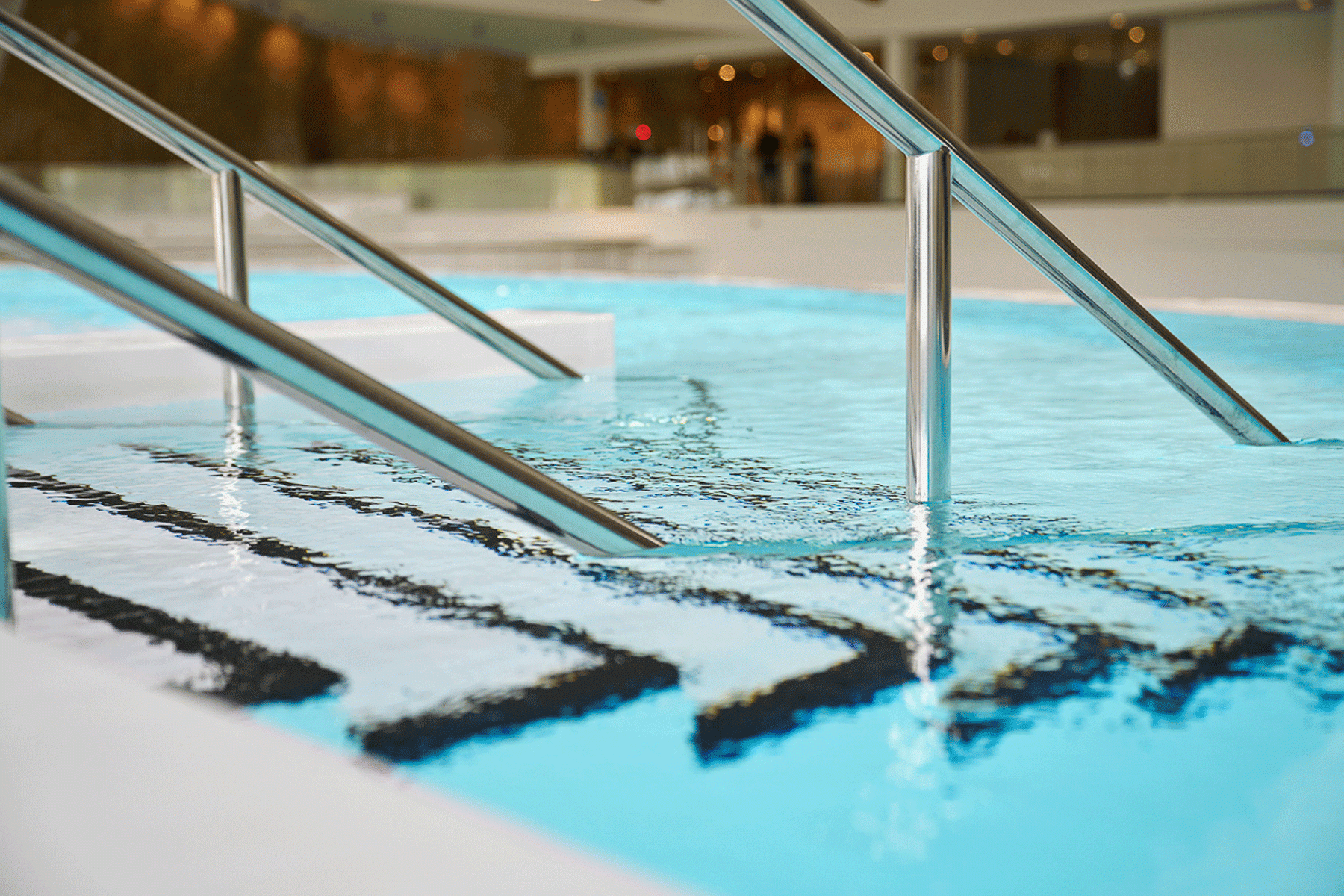 stairs leading into indoor swimming pool 
